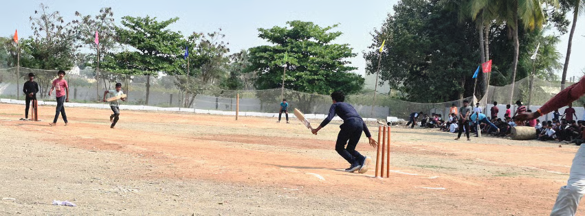 Students playing a cricket match