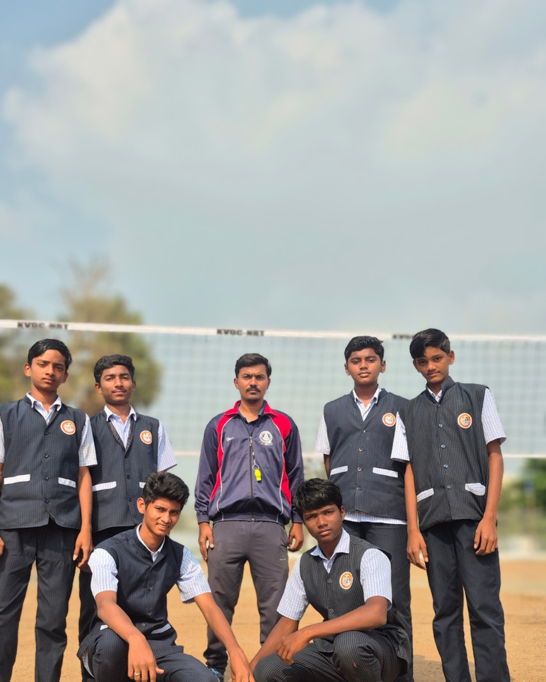 School volleyball team with coach