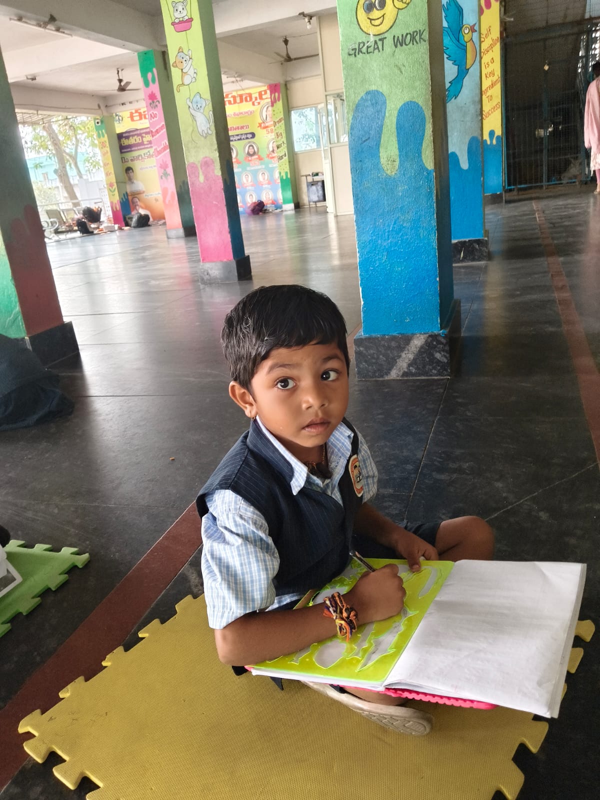 Young student drawing in a notebook